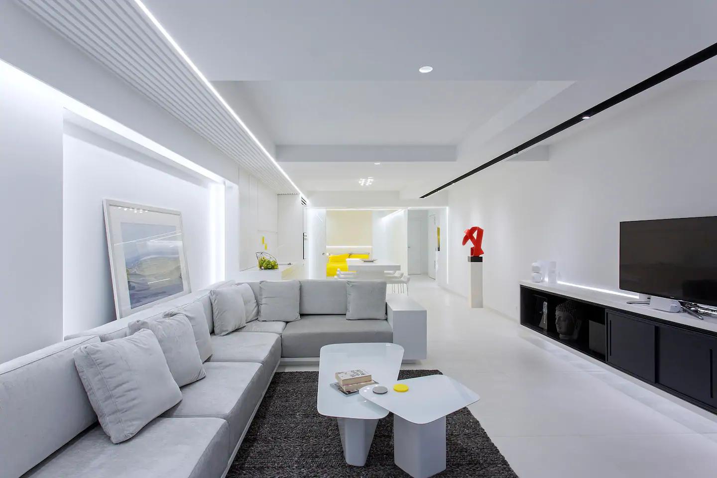 White living room with volumetric designs